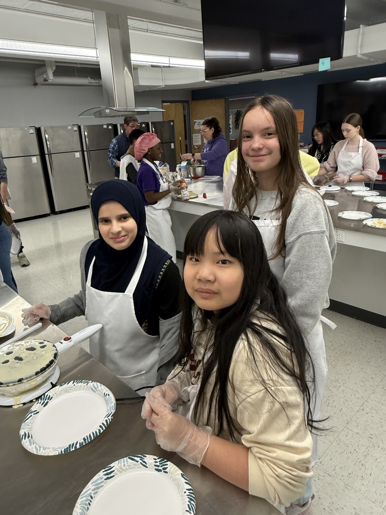 Crepe day at shaker middle school with three students making crepes