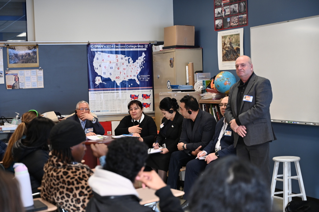Uzbekistan parliament members and translator answer students' questions