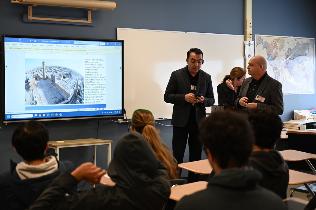 Uzbekistan parliament member and translator present to students