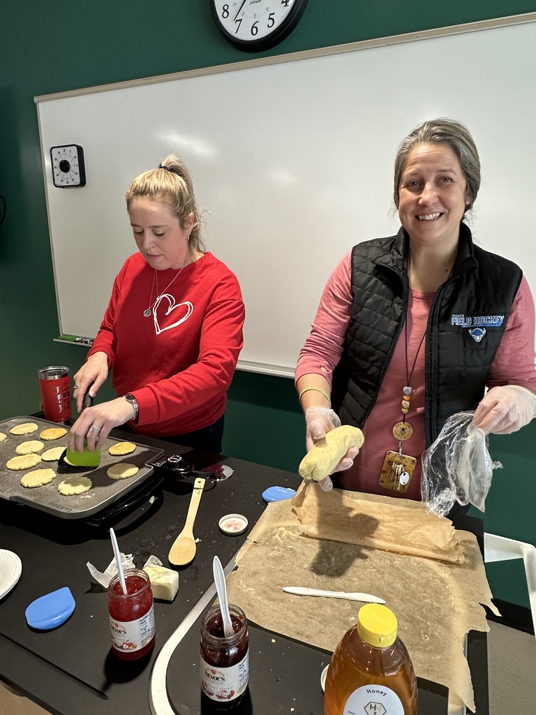 Mrs. Cost and Ms. Guba prepare and cook johnnycakes using the Charlie Cart.