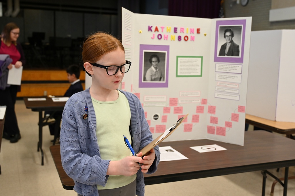A student presents on Katherine Johnson.
