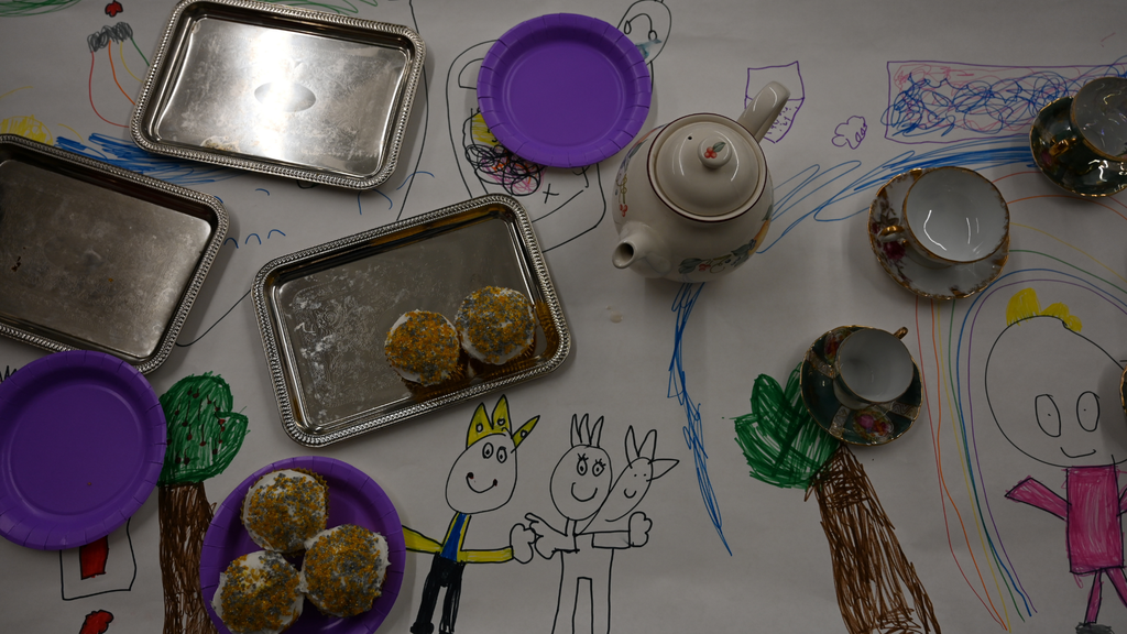 Tea, cupcakes and a colored in placemat