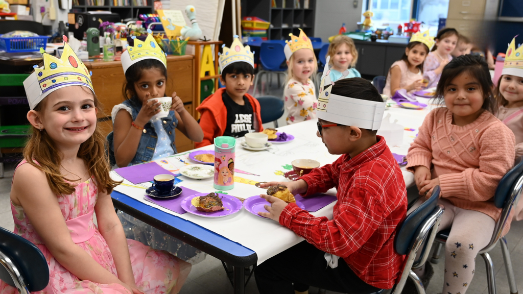 Kindergarteners smiling at Southgate Kings & Queens Day
