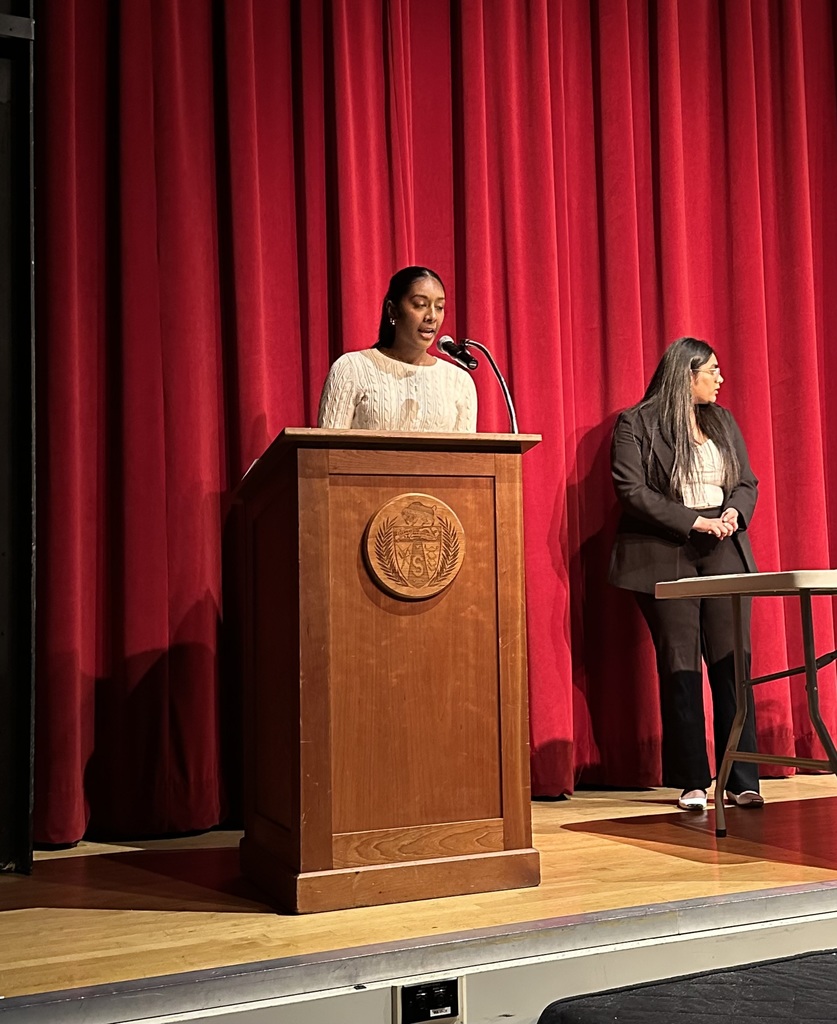 Student speaking at spanish honors society