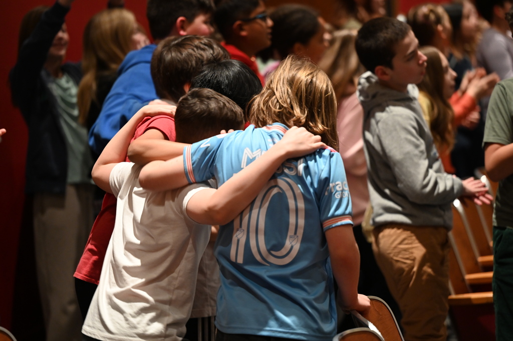 three students dancing to the music