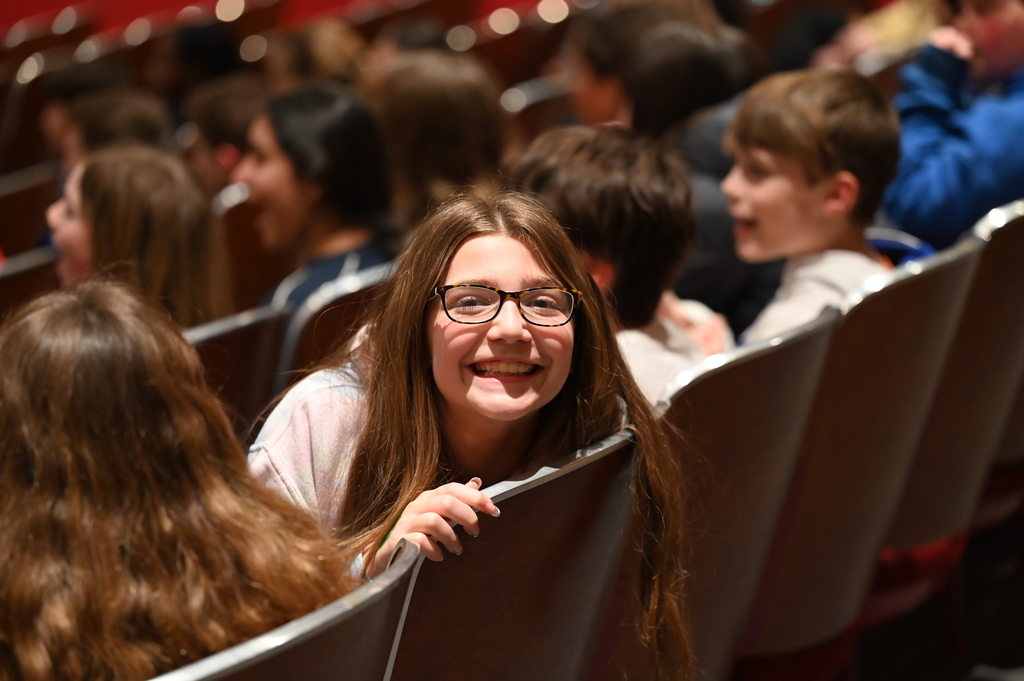 girl smiling in the stands