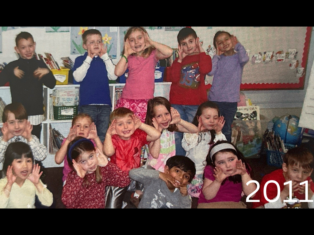 children smiling and making silly faces in 2011