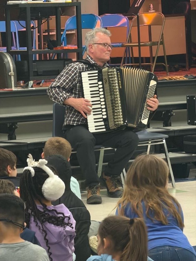 Accordion playing at latham ridge for irish heritage presentation