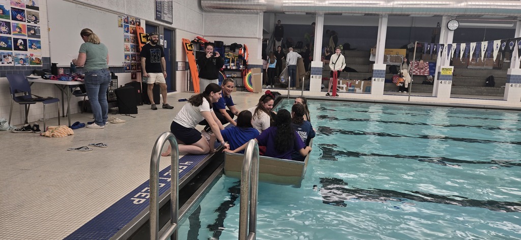 Students and teachers assist with boat race