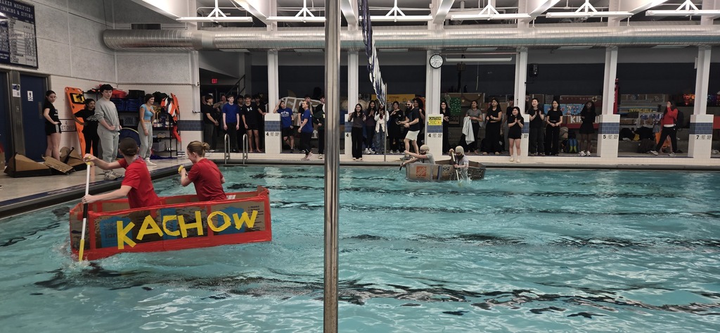SHS students watch the boat "Kachow" move across the finish line