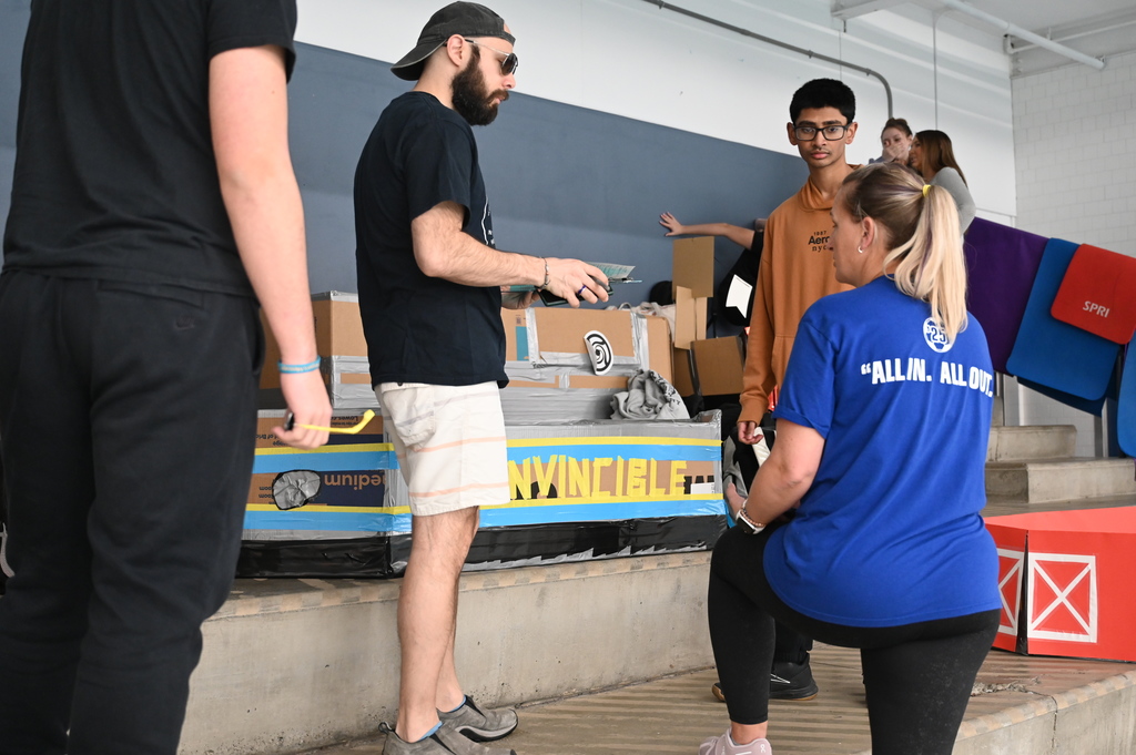 Physics teacher chat with student before race