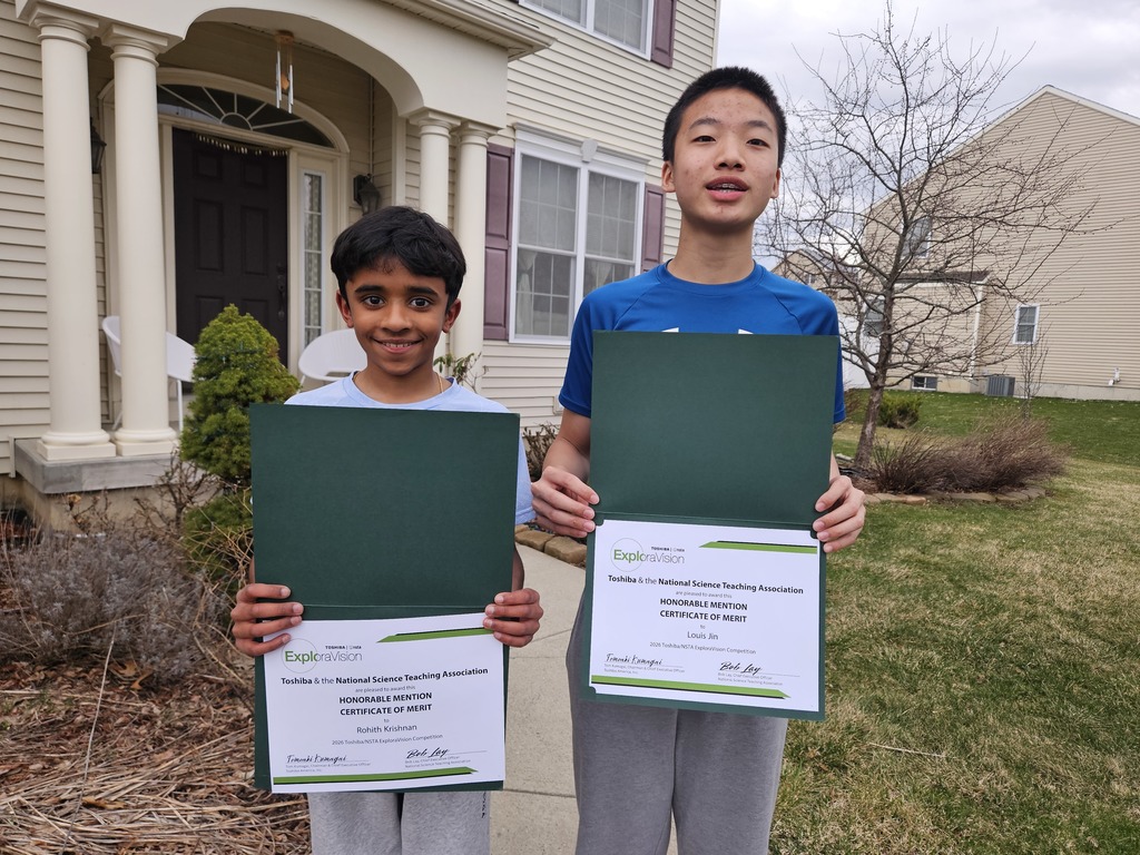 Rohith and Louis holding their certificates