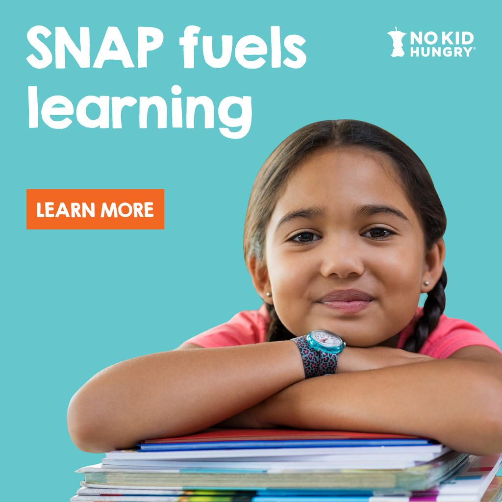 An image of a student leaning on books and folders and smiling. The graphic says "SNAP fuels learning."