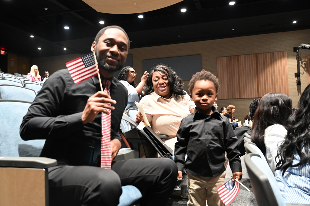 Newly Naturalized Citizen with his family