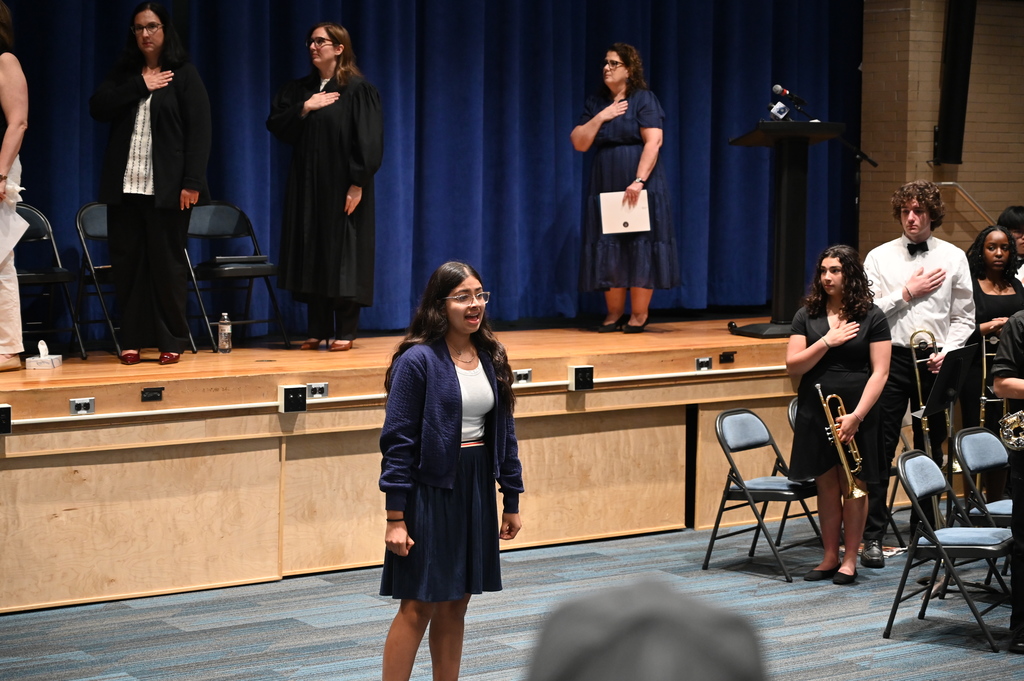 Eighth grader Arya Parikh sings the National Anthem
