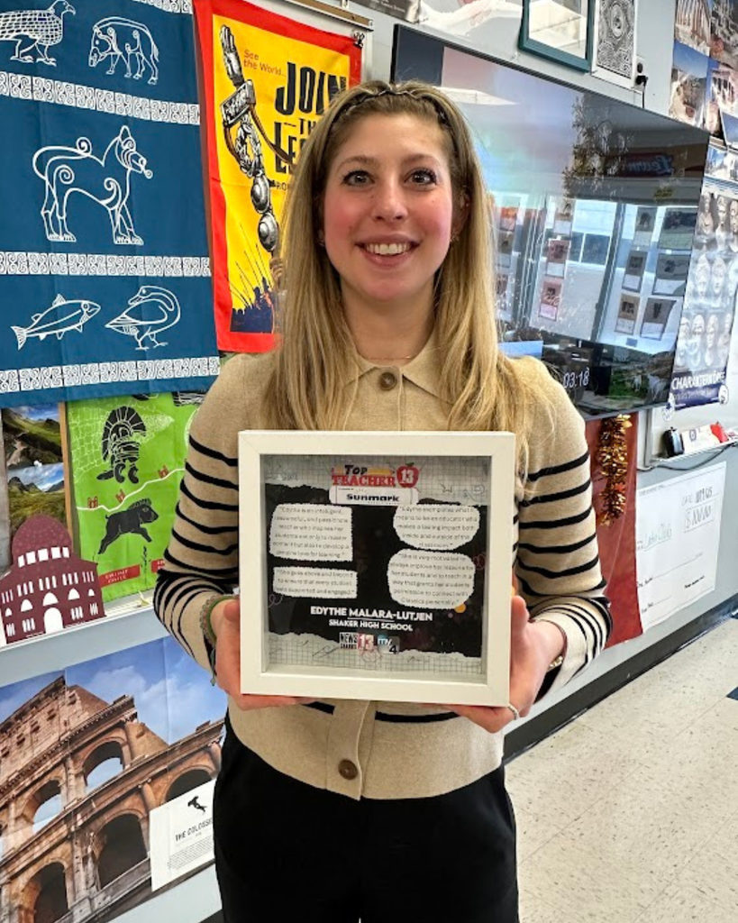 Shaker High School Latin Teacher Edythe Malara-Lutjen holds her WNYT Top Teacher Award