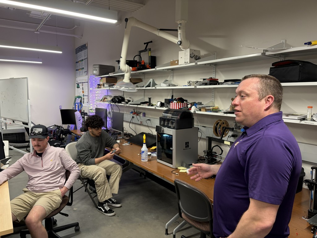 UAlbany professors speak to high schoolers from a computer lab.