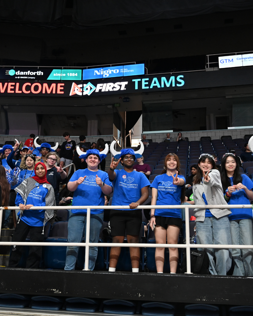 Robotics members watching a match
