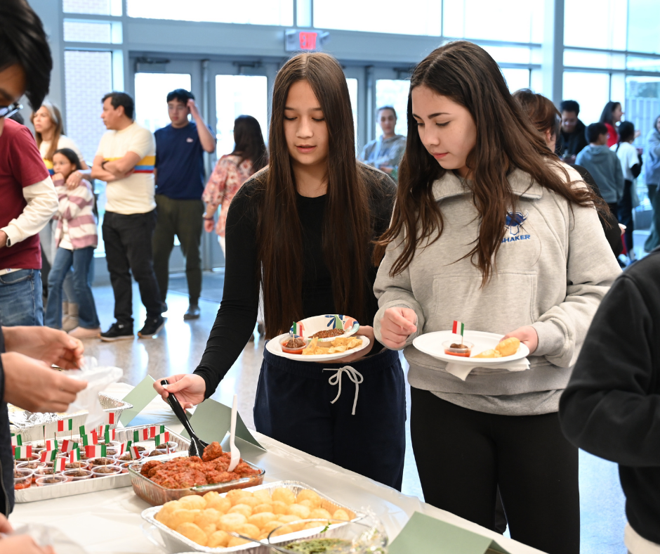 Students taking goodies from the table