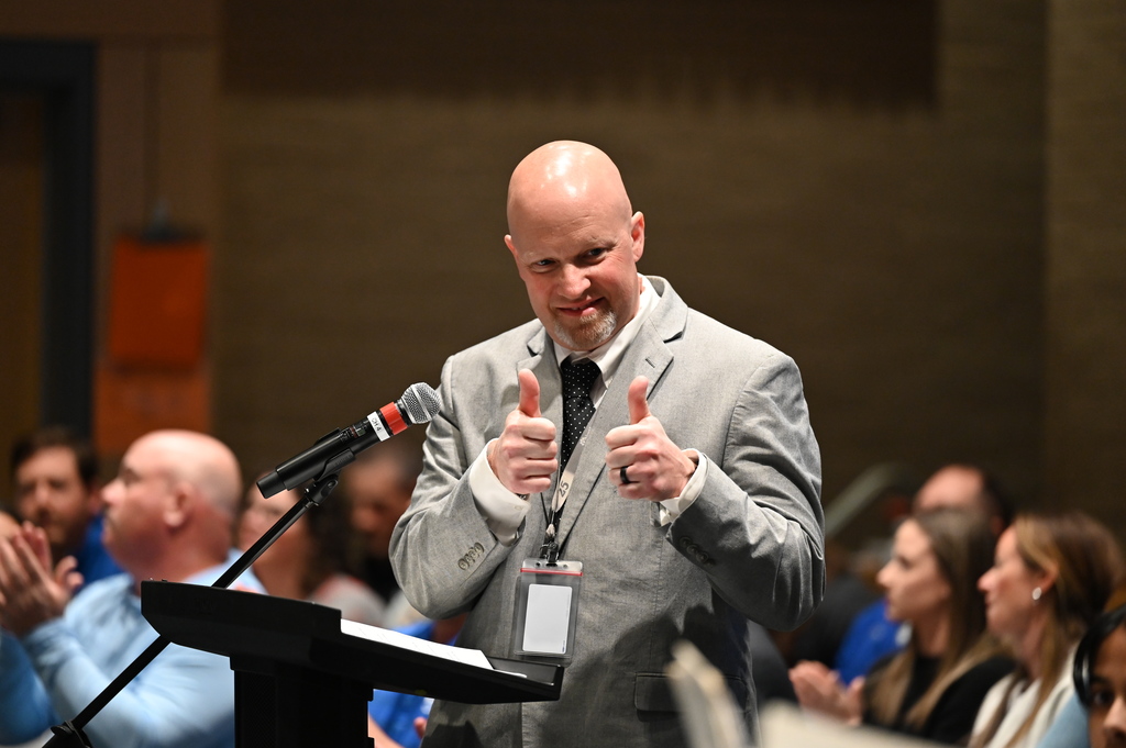Dave Stadtlander, Supervisor of Secondary Health, P.E., and Athletics, congratulates SMS Jazz band on a good job
