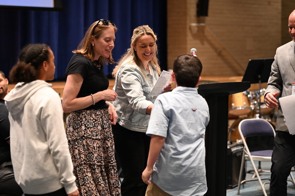 Blue Creek P.E. Teachers hand awards to students