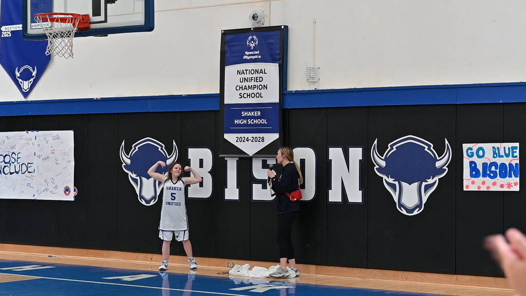 Leigh Howard from Special Olympics New York unveiled our brand new National Unified Champion School banner alongside unified athlete Kiki Growick