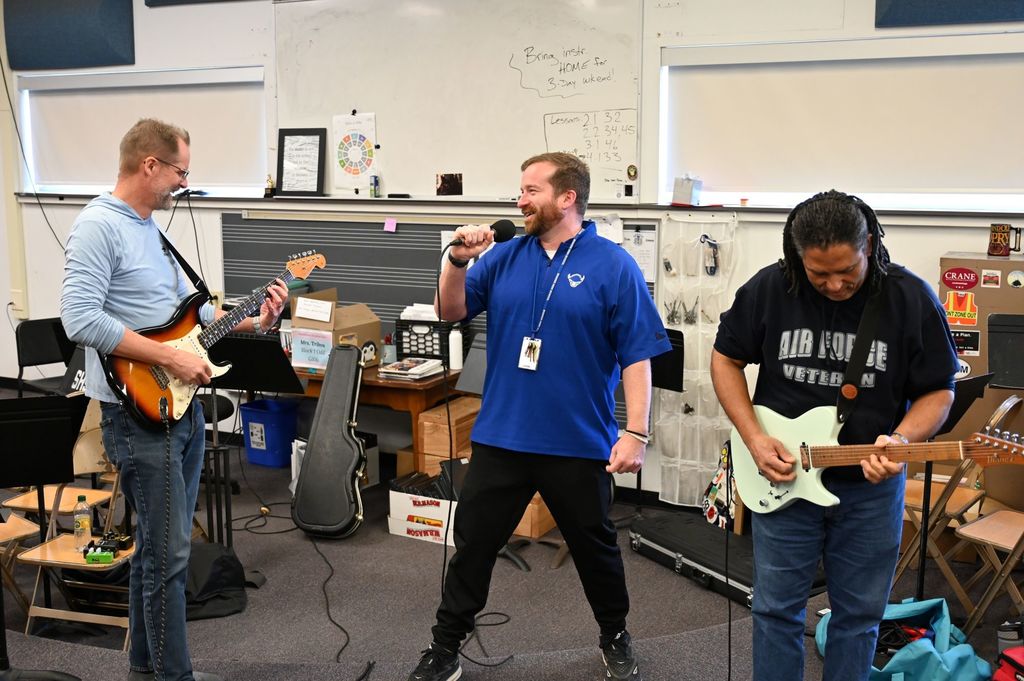garrett and marc jackson singing and playing guitar