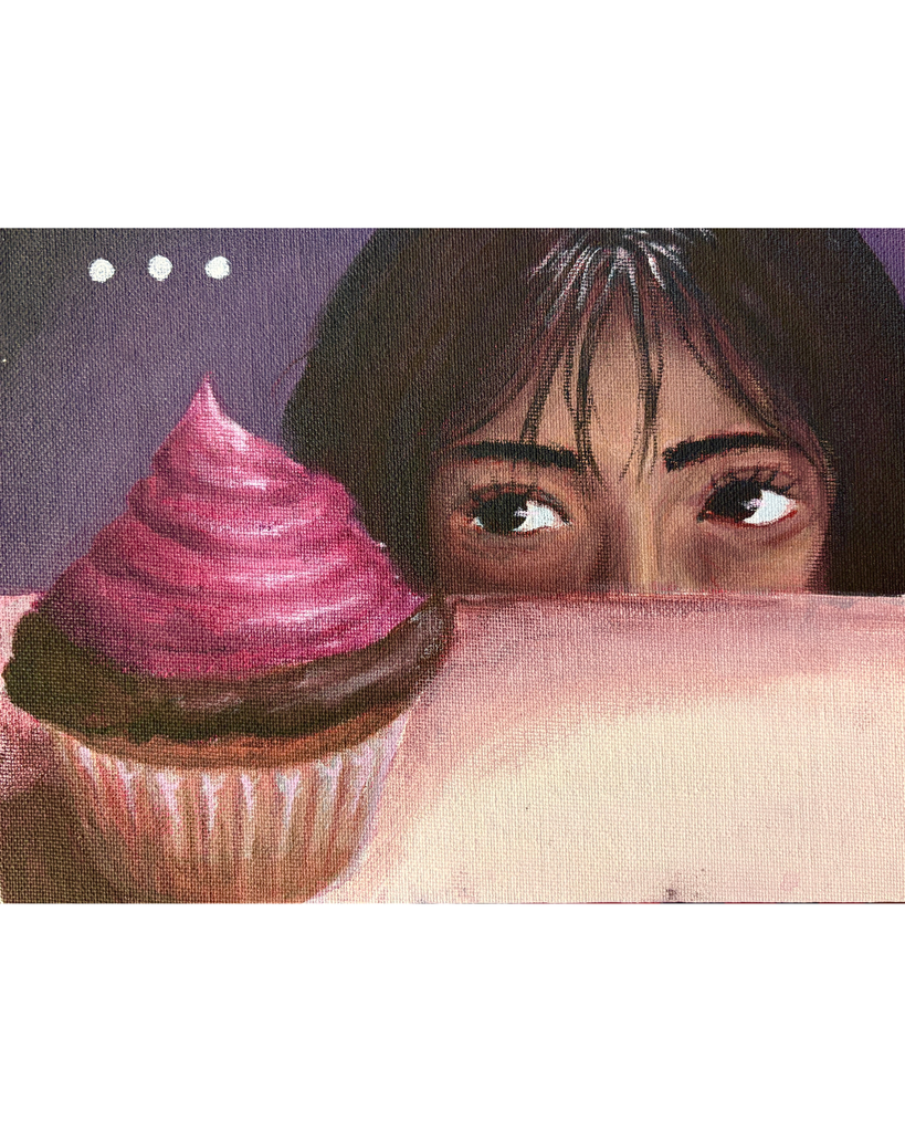 Cupcake with someone eyeing it