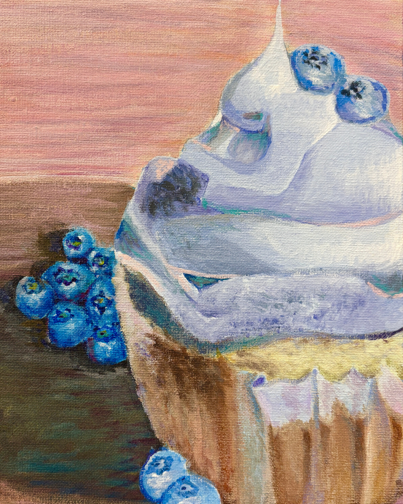 Blueberry cupcake with blueberries around it