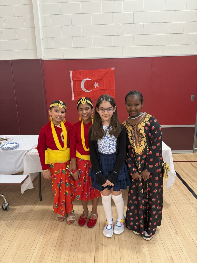 four students in lovely attire