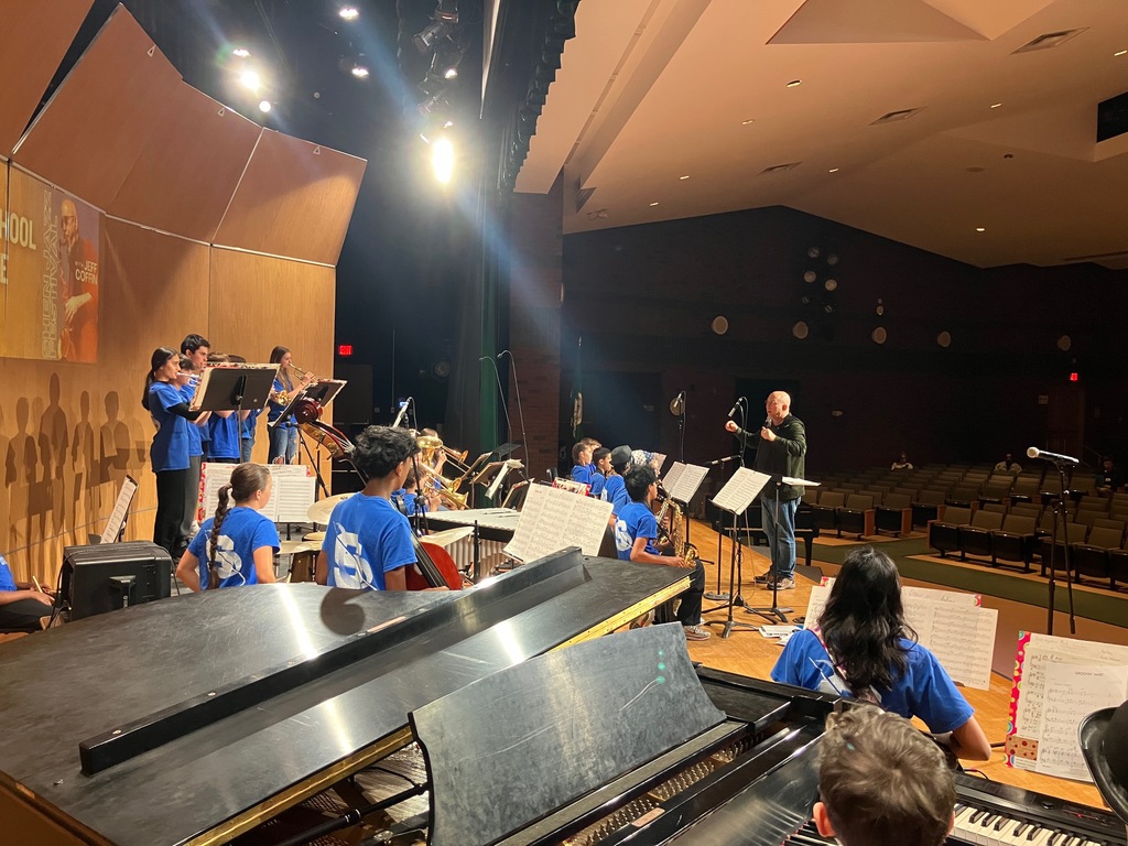 Members of the SMS Jazz Ensemble perform on stage.