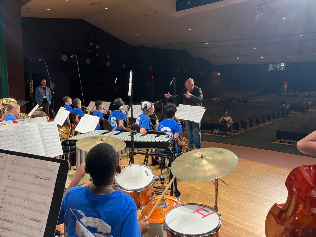 Members of the SMS Jazz Ensemble perform on stage.