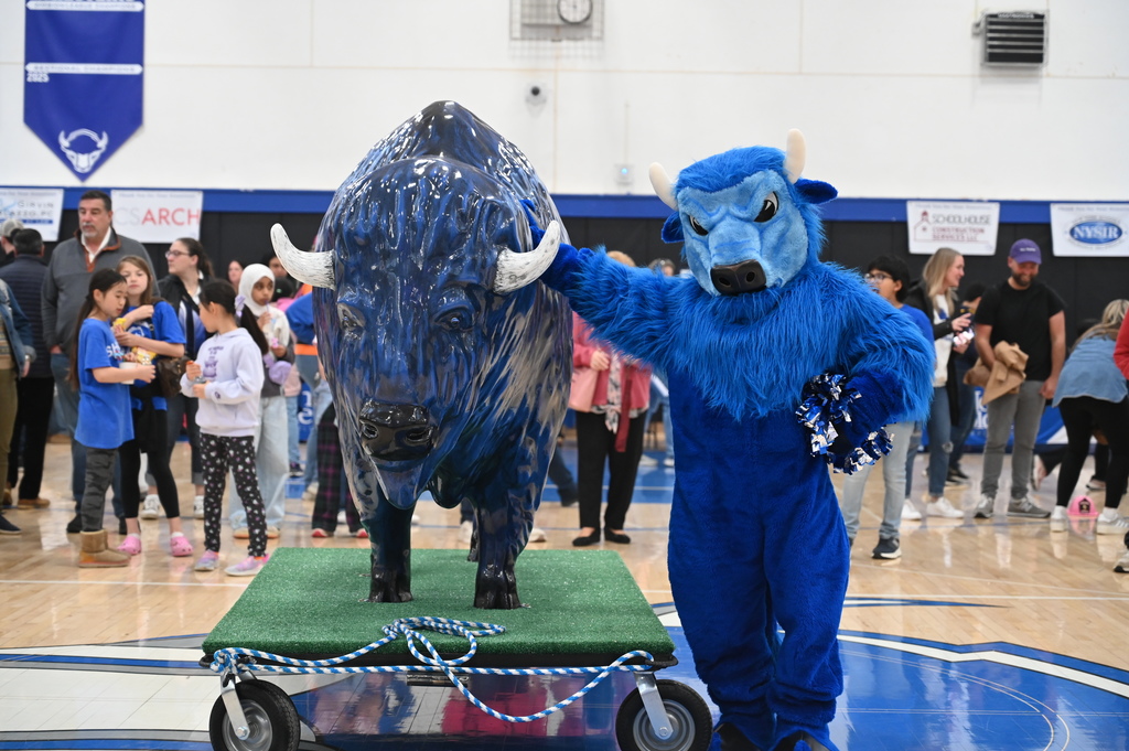 Bryson the Bison with the class of 2026's gift, a huge fiberglass bison!