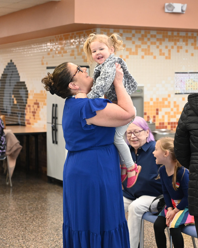 Superintendent Skeals with a milestone recipient's daughter