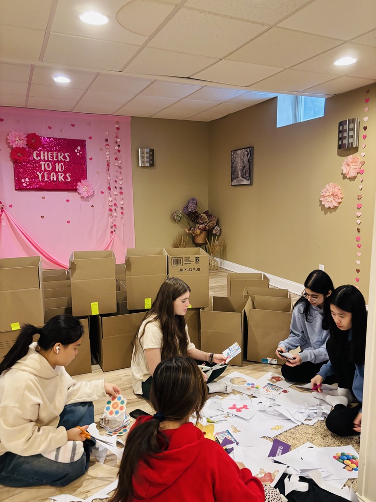 students organizing donations for the club