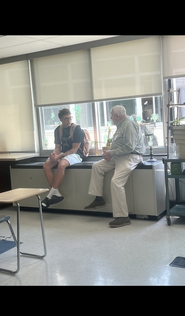 Mr. Berlin talking to a student