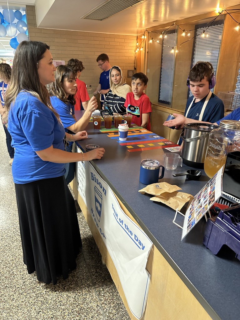 Bison Brew students serve beverages to faculty members.