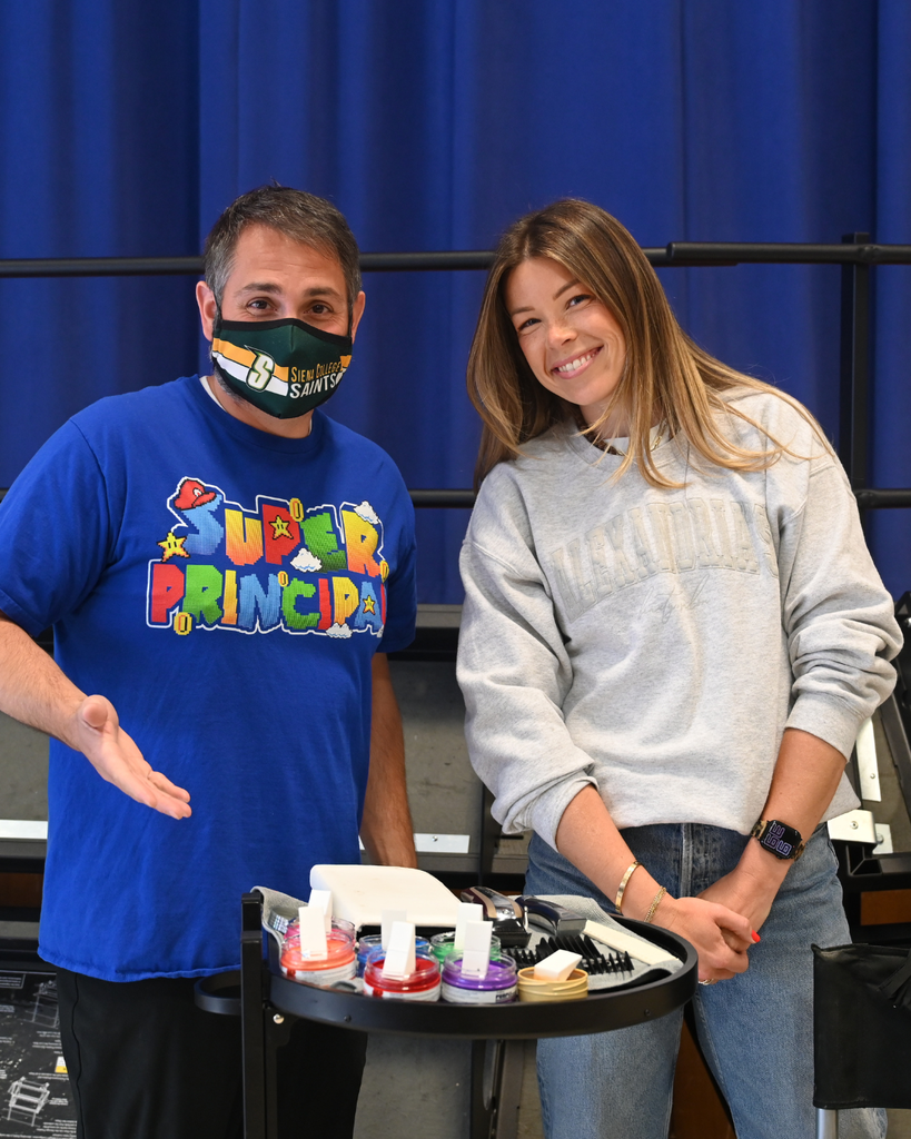 Mr. Turcio and Alex Cook getting materials ready for haircut