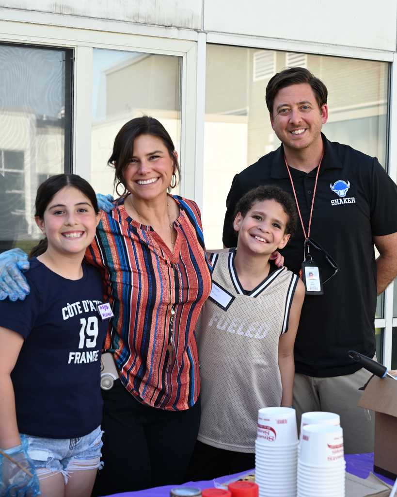 Two Latham Ridge students and teachers helping serve ice cream