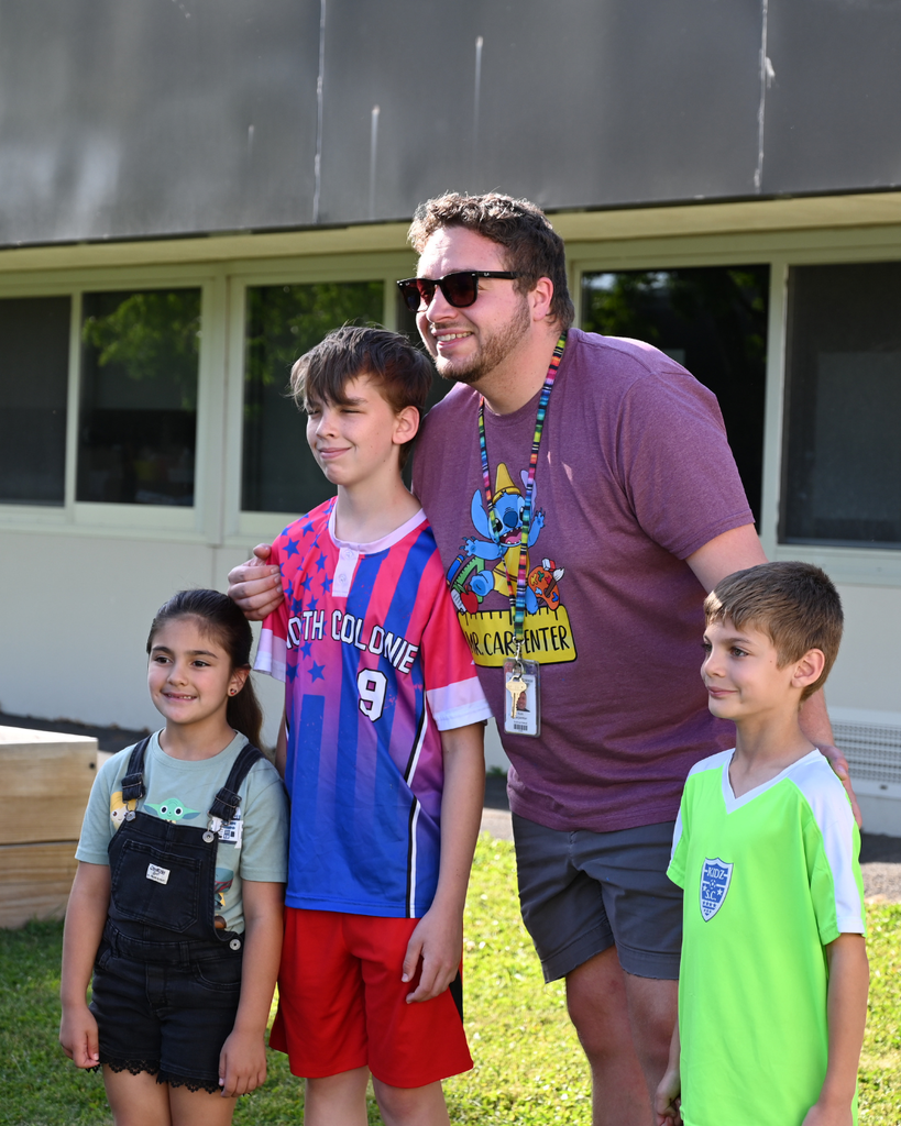 Latham Ridge students take picture with past and current teacher