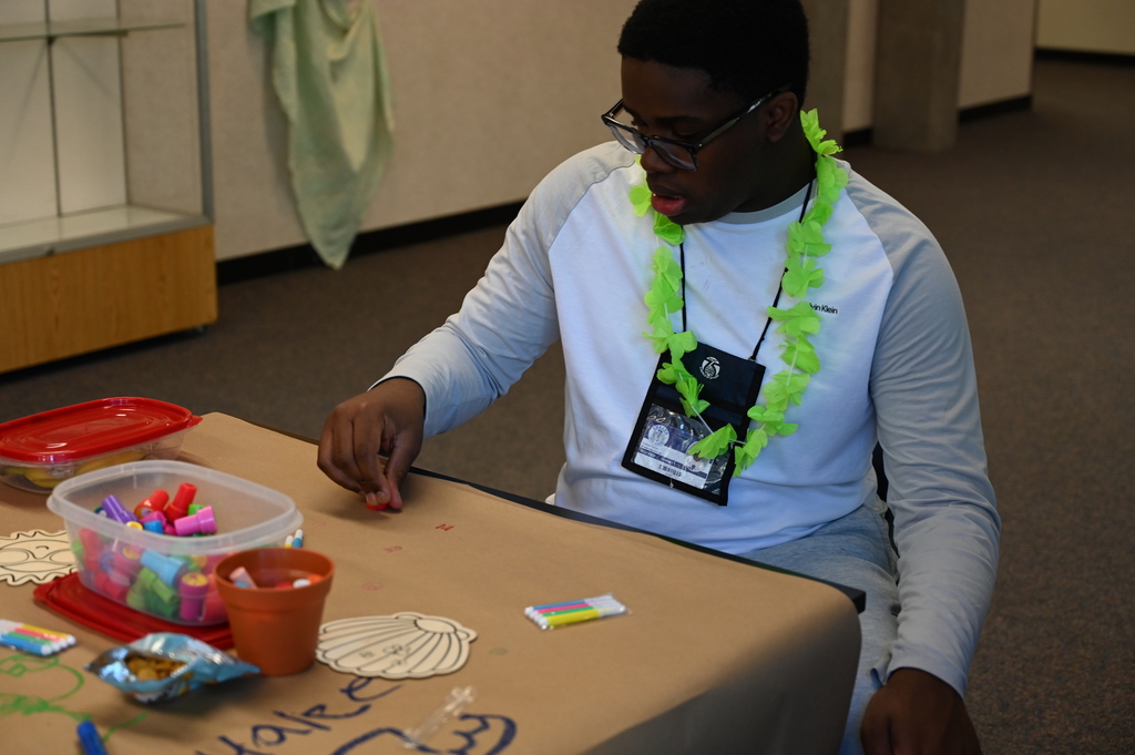 Student playing with stamps