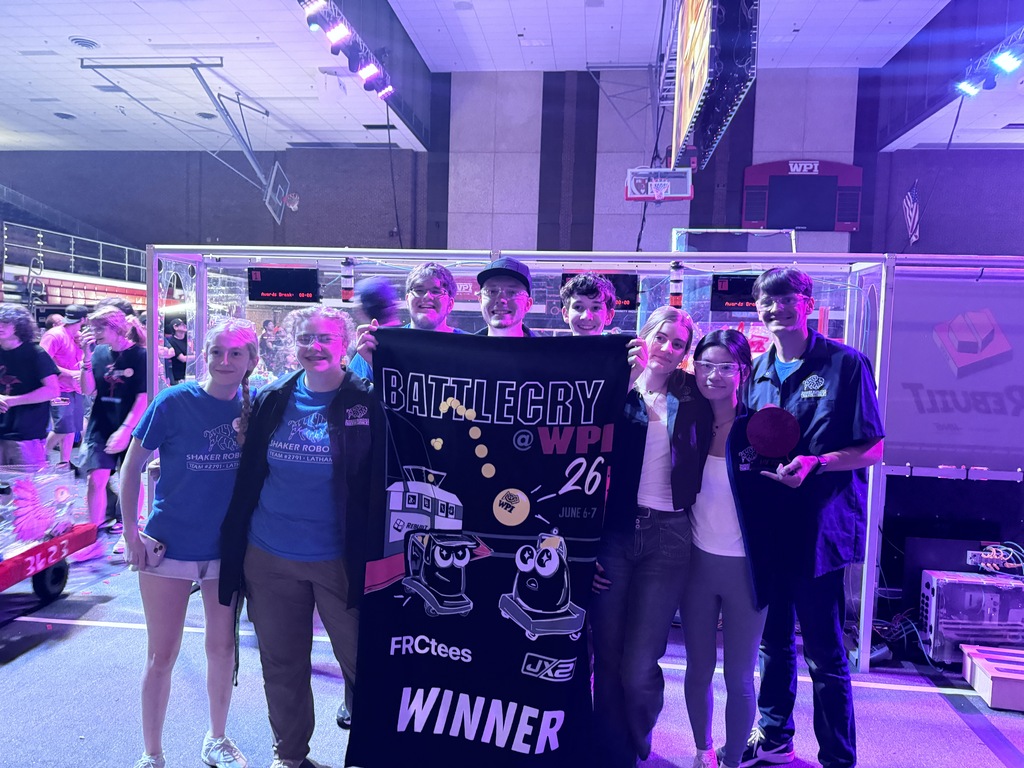 robotics students standing together after winning championships
