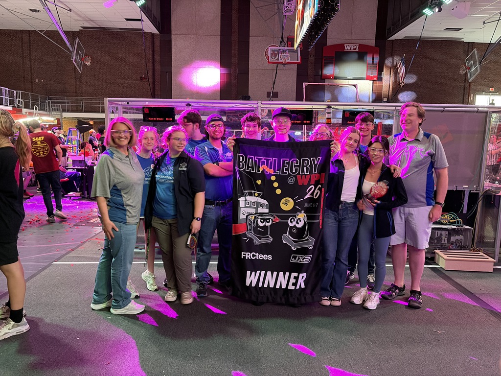 robotics students standing together after winning championships