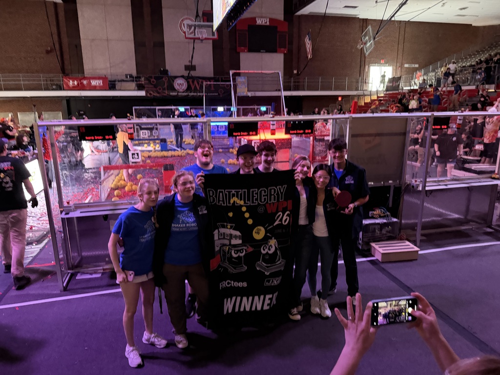 robotics students standing together after winning championships