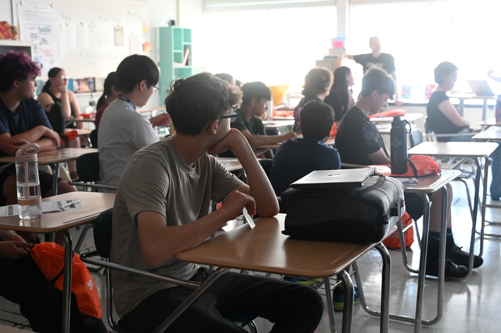 Students listening to an orthodontist