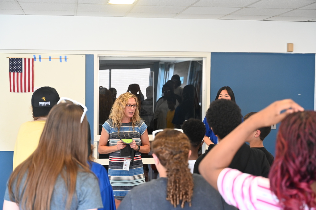 SHS's LaFollette Hall Principal Nikki Newidomy shows students how to use Yondr pouches