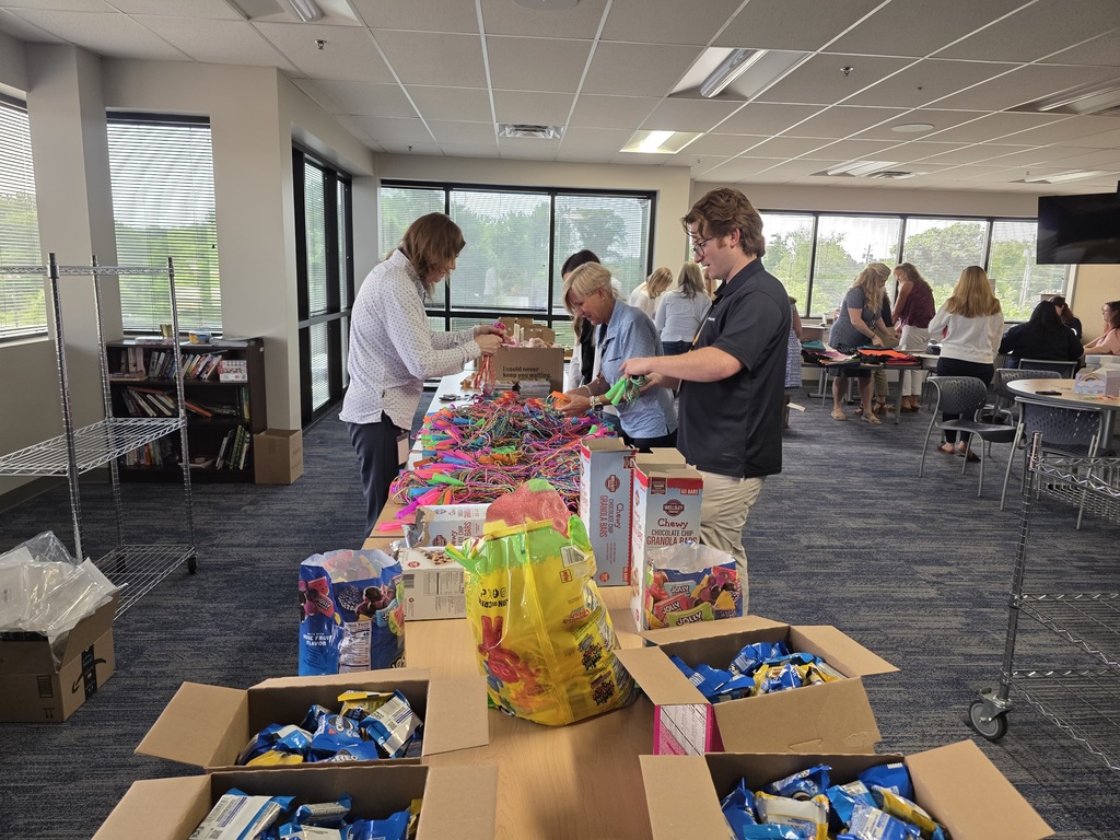 Nearly a dozen people work in an assembly line to build Gleeboxxes.