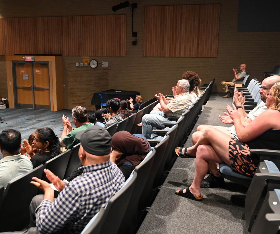 Audience applauds student's speech