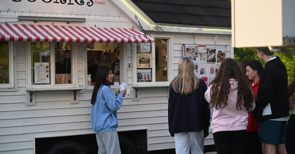 Seniors get cookies from the Little Cookie House