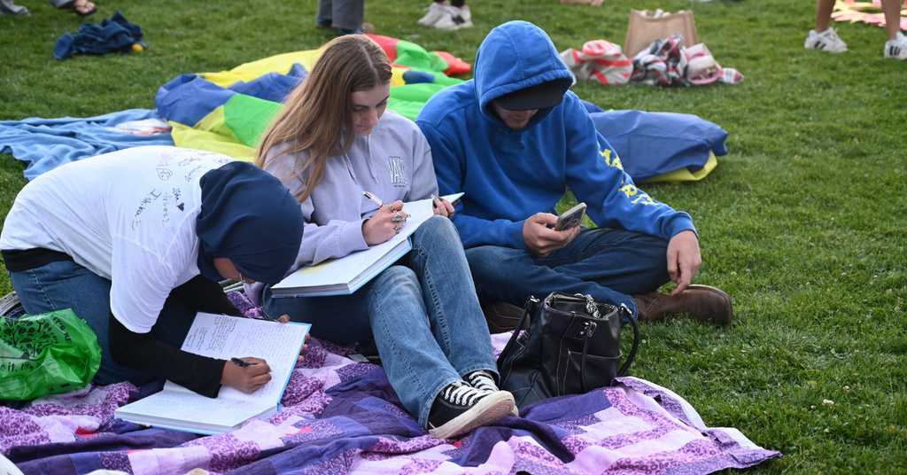 Students sign yearbooks